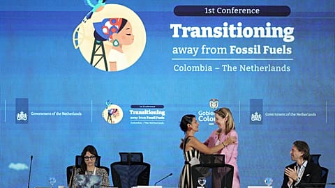 Stientje van Veldhoven, Minister of Climate Policy and Green Growth of the Netherlands, right, embraces Colombia's Environmental Minister Irene Vélez Torres.