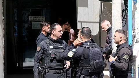 Police officers outside the offices of the National Social Security Fund in Athens, after a shooting incident, 28 April 2026