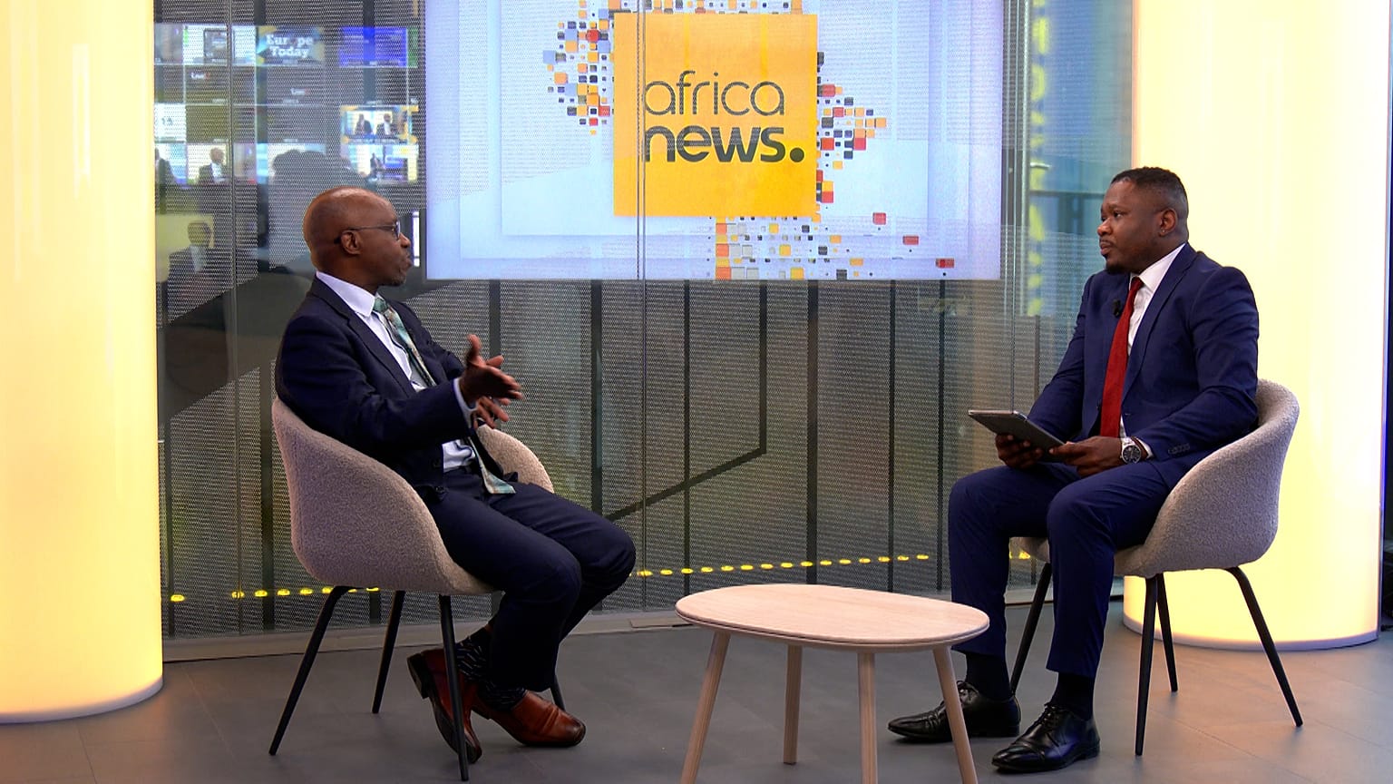 (L) Mr. Montfort Mlachila, IMF Deputy Director of the African Department, (R) Jerry Fisayo-Bambi, Euronews Journalist 