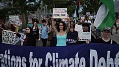 Activists participate in a demonstration during a conference aimed at transitioning away from fossil fuels Monday, April 27, 2026, in Santa Marta, Colombia.