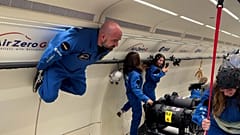 Scientists float in zero gravity during parabolic flight experiments