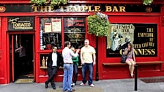This April 9, 2011 photo shows people outside The Temple Bar in the Temple Bar area in central Dublin, Ireland.