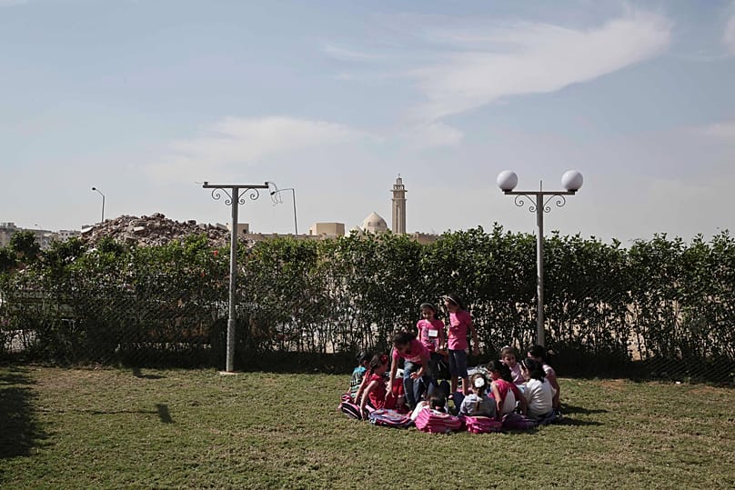 FILE: Syrian refugee girls play during their break time at the Civilisation Builders Educational Centre in the 6th of October suburb west of Cairo. 12 October 2015