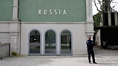 A private security officer stands next to a closed Russia's pavilion at the 59th Biennale of Arts exhibition in Venice, 19 April, 2022