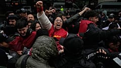 Union members scuffle with Turkish police officers as they try to march towards Taksim Square in Istanbul, 1 May, 2026