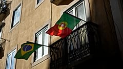 Brazilian and Portuguese flags on a balcony