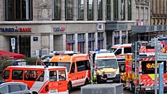 Emergency services stand at the entrance to Grimmaische Strasse after a car crashed into several people in Leipzig, 4 May, 2026