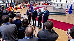 US Trade Representative Jamieson Greer standing among other officials in Brussels, Belgium on 24 November 2025.
