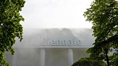 FILE: The main building of the Venice Biennale covered in smoke during a protest against Israeli participation in 2019.