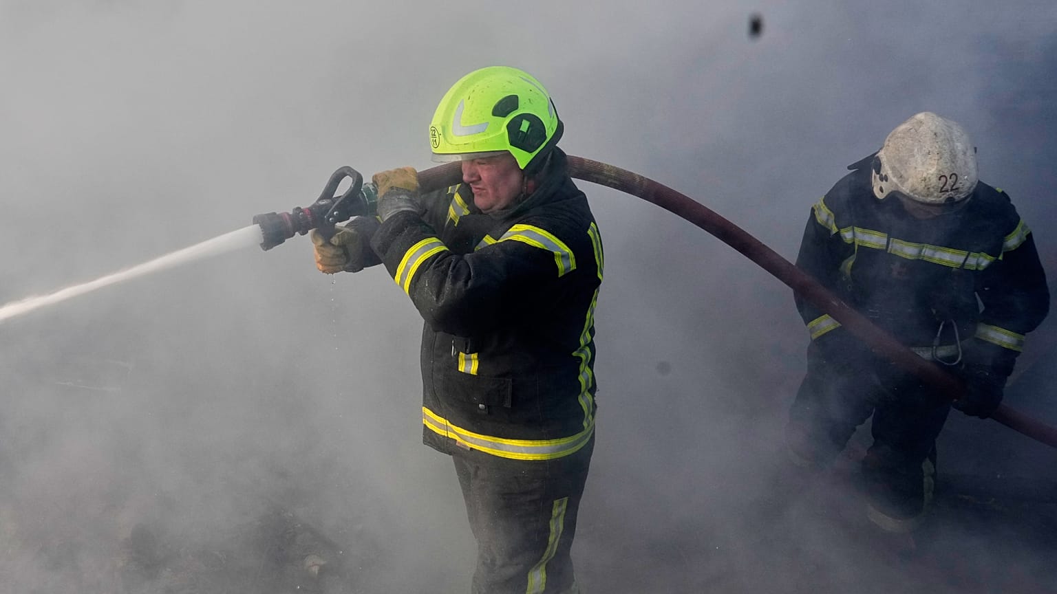 FILE: Firefighters put out the fire at a residential neighbourhood following a Russia missile and drone attack, in Brovary, close to Kyiv,