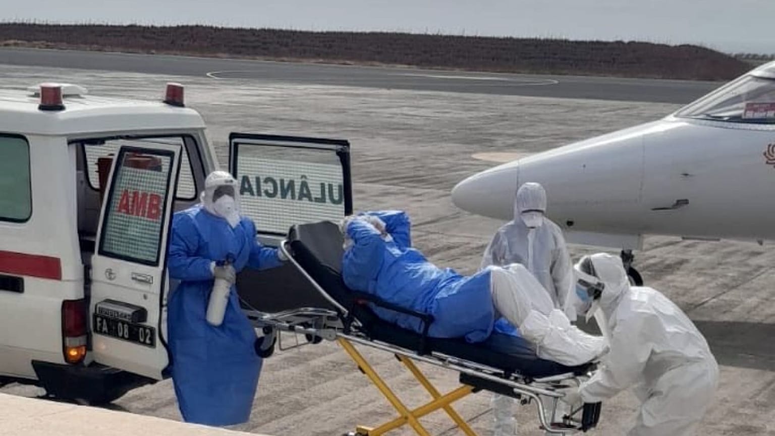 One of the evacuees exits the vehicle to be transferred to the medical aircraft.