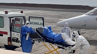 One of the evacuees exits the vehicle to be transferred to the medical aircraft.
