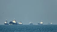 Container ships sit at anchor in the Strait of Hormuz off Bandar Abbas, 4 May, 2026