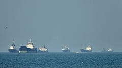 Container ships sit at anchor in the Strait of Hormuz off Bandar Abbas, 4 May, 2026
