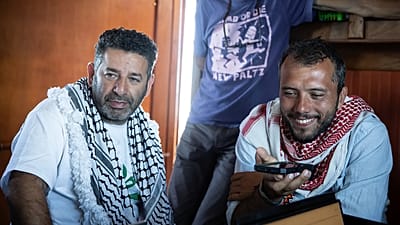 Saif Abukeshek and Thiago Ávila on the Greenpeace vessel Arctic Sunrise in the Mediterranean Sea, 18 April, 2026