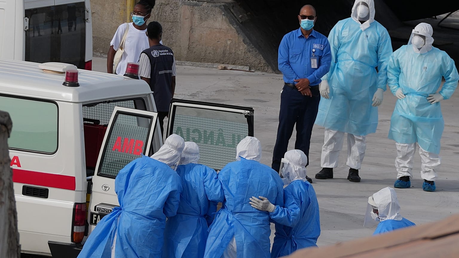 Health workers in protective gear evacuate patients from the MV Hondius cruise ship into an ambulance