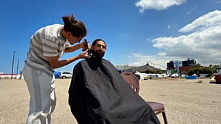 At Beirut shoreline camp, volunteer barber brings dignity with free haircuts