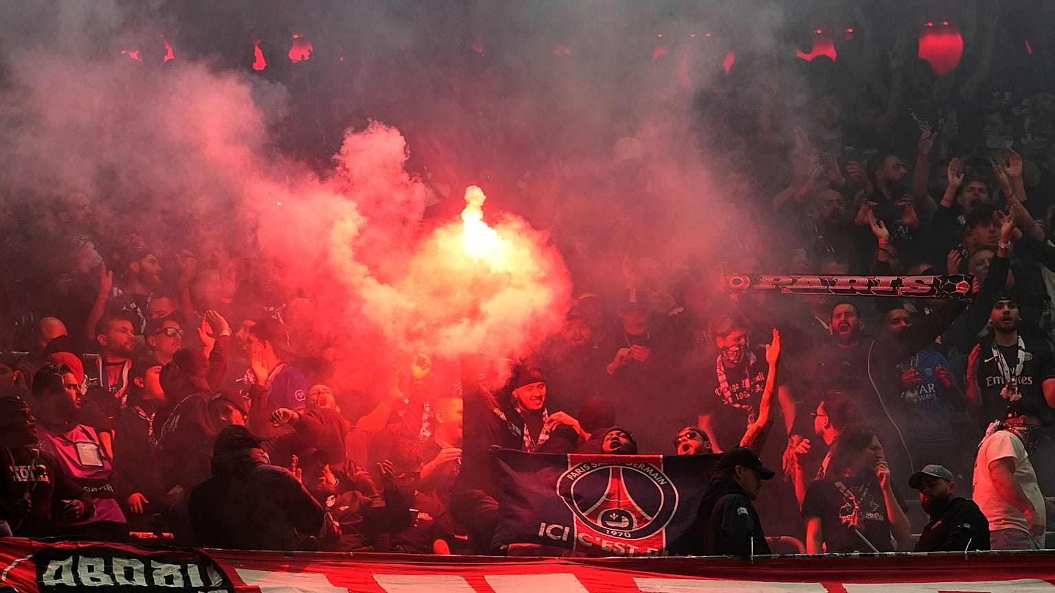 PSG's fans cheer for their team during the Champions League semifinal second leg soccer match between Bayern Munich and Paris Saint Germain in Munich, Germany