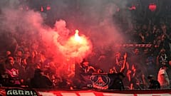 PSG's fans cheer for their team during the Champions League semifinal second leg soccer match between Bayern Munich and Paris Saint Germain in Munich, Germany