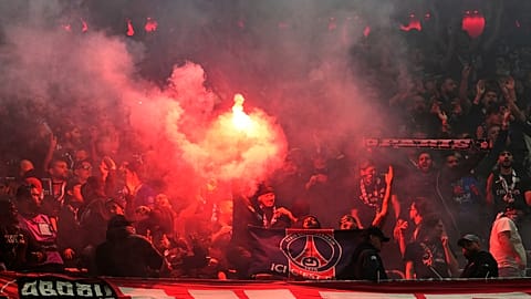 PSG's fans cheer for their team during the Champions League semifinal second leg soccer match between Bayern Munich and Paris Saint Germain in Munich, Germany