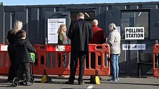 Voters queue at a polling station in Walton on the Naze, 7 May, 2026