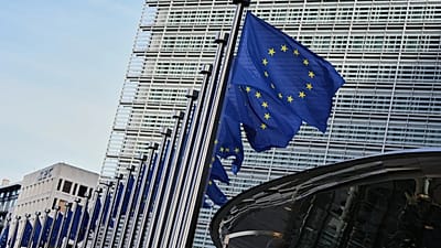 European Union flags flap in the wind outside of EU headquarters in Brussels, 4 November, 2025