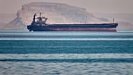 A bulk cargo ship sits at anchor in the Strait of Hormuz off Bandar Abbas, Iran, Saturday, May 2, 2026.