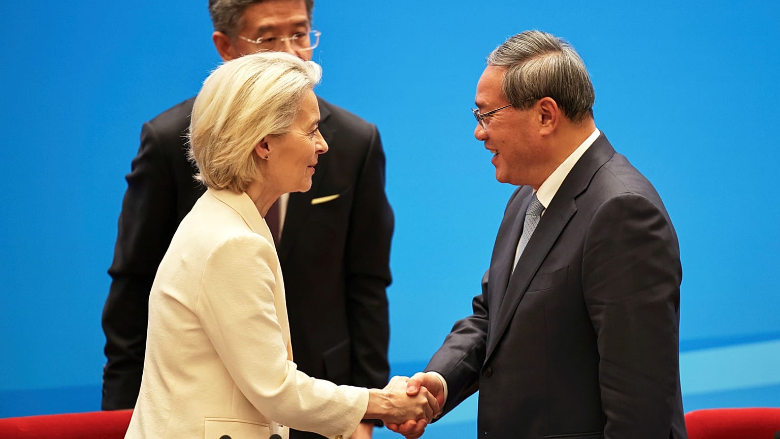 Chinese Premier Li Qiang, right, shakes hands with European Commission President Ursula von der Leyen at the end of the China Business Leaders Symposium.