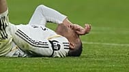 Real Madrid's Kylian Mbappe lies on the pitch after injuring during the Champions League quarterfinal second leg soccer match between Bayern Munich and Real Madrid in Munich