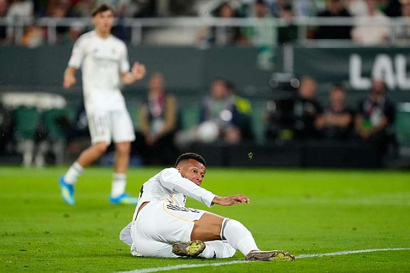Real Madrid's Kylian Mbappe sits on the pitch after taking a shot during a La Liga soccer match between Real Betis and Real Madrid in Seville, Spain, Friday, April 24, 2026