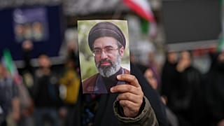 FILE: A demonstrator holds a picture of Iran's Supreme Leader Mojtaba Khamenei, in Tehran, 8 April 2026
