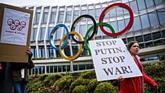 Protesters urge the IOC to reconsider allowing Russian and Belarusian athletes to compete under a neutral flag in Lausanne, 25 March, 2023