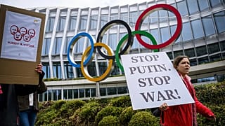 Protesters urge the IOC to reconsider allowing Russian and Belarusian athletes to compete under a neutral flag in Lausanne, 25 March, 2023