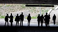 Migrant pupils walk under a railway bridge in Flen, 30 August, 2018