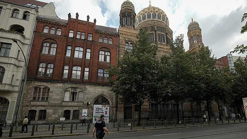 A police officer patrols in front of the "New Synagogue" in Berlin's city centre.