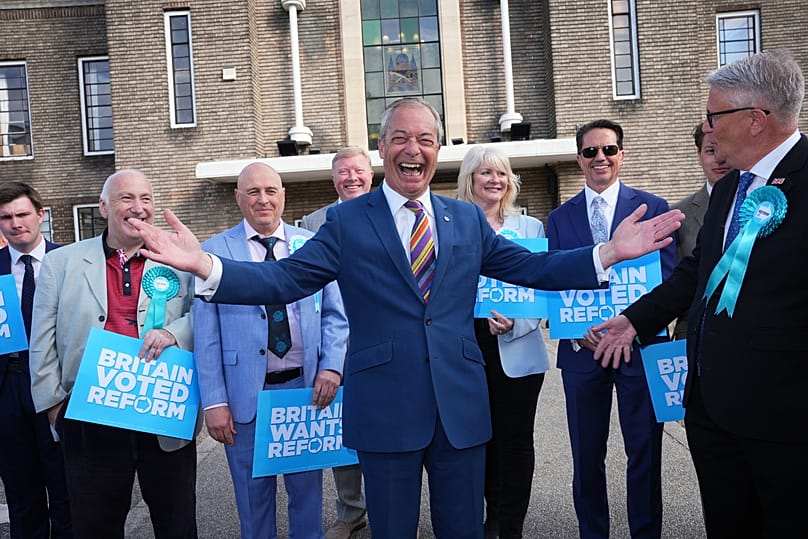 Reform UK leader Nigel Farage poses for a photo during a visit to Havering Town Hall in Romford, 8 May, 2026