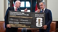 Canada Prime Minister Mark Carney, right, is presented with a novelty World Cup ticket by FIFA President Gianni Infantino on Parliament Hill in Ottawa,Friday, 10 Oct 2025.