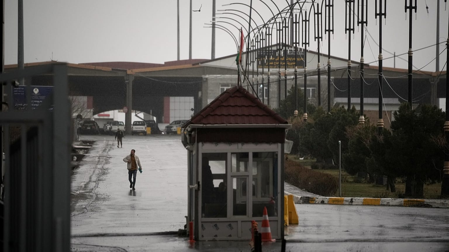 FILE: An Iranian man crosses the Haji Omeran border crossing on foot between Iran and the autonomous Kurdistan Region of Iraq (KRI), 15 March 2026