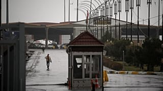 FILE: An Iranian man crosses the Haji Omeran border crossing on foot between Iran and the autonomous Kurdistan Region of Iraq (KRI), 15 March 2026