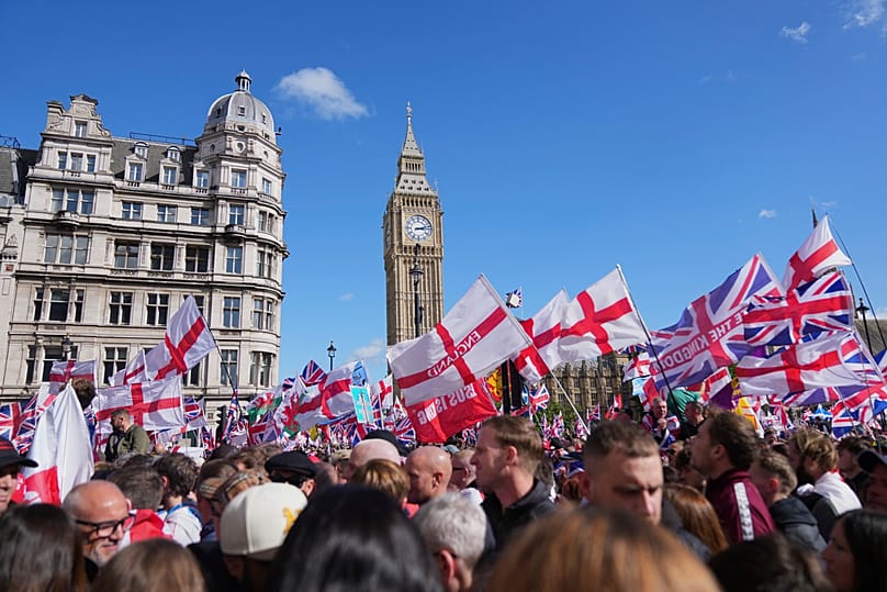 FILE - People demonstrate during the Tommy Robinson-led Unite the Kingdom march and rally, London, 13 September 2025