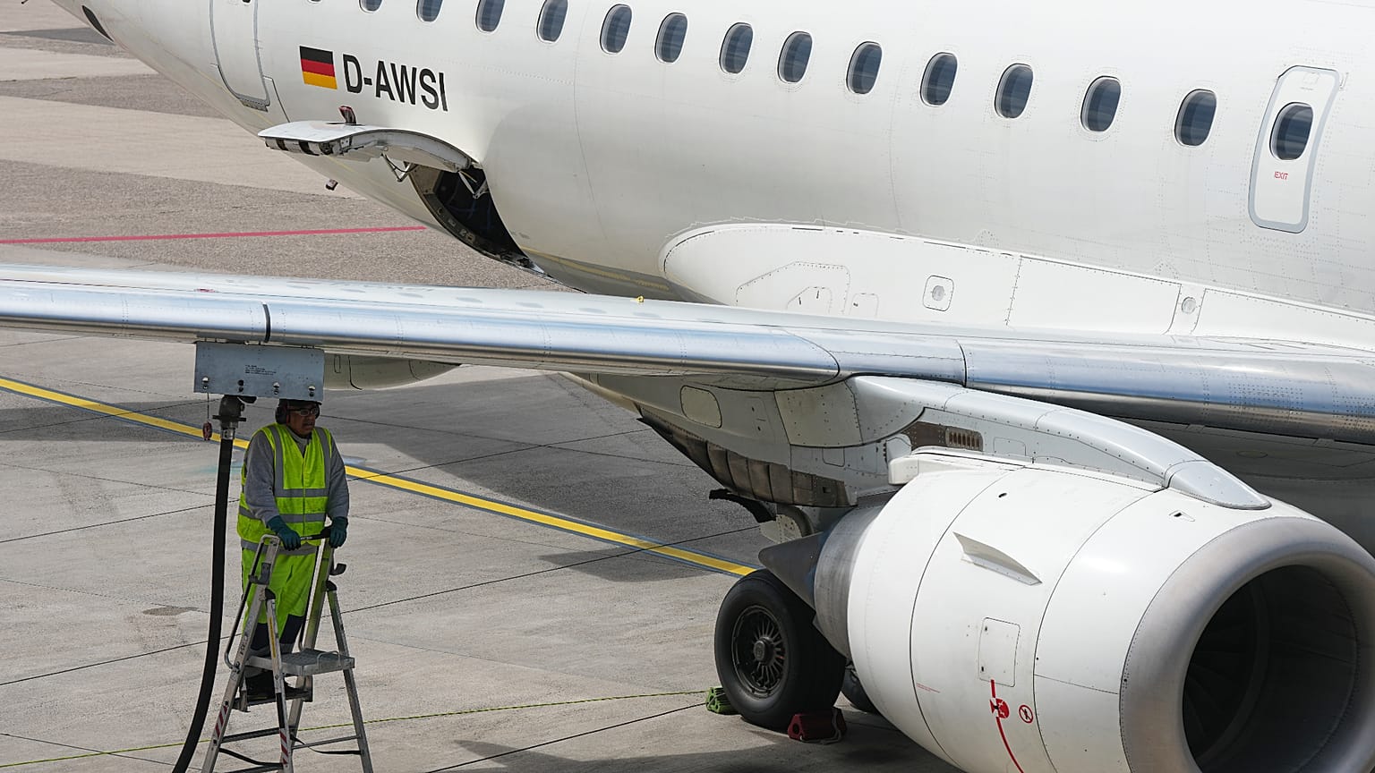 A worker fills up an aircraft with jet fuel at the airport in Duesseldorf, Germany, when airlines fear a kerosene shortage due to the war in Iran, Monday, April 27, 2026.