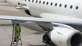 A worker fills up an aircraft with jet fuel at the airport in Duesseldorf, Germany, when airlines fear a kerosene shortage due to the war in Iran, Monday, April 27, 2026.