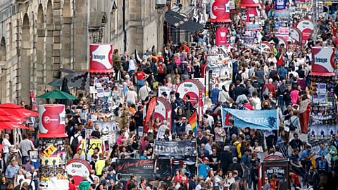 Crowds mingle on Edinburgh's Royal Mile during the 2016 Edinburgh Fringe Festival, Monday, Aug. 22, 2016. The Fringe remains the largest performing arts festival in the world 
