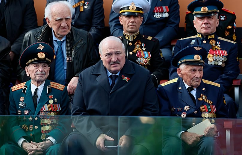 FILE: Aliaksandr Lukashenka watches the Victory Day military paradein Red square in Moscow, Russia, May 9, 2023.