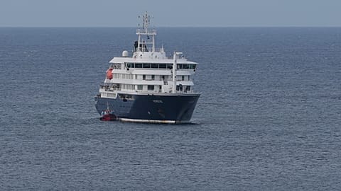 The MV Hondius cruise ship departs the port in Praia, Cape Verde, Wednesday, May 6, 2026. (AP Photo/Misper Apawu)