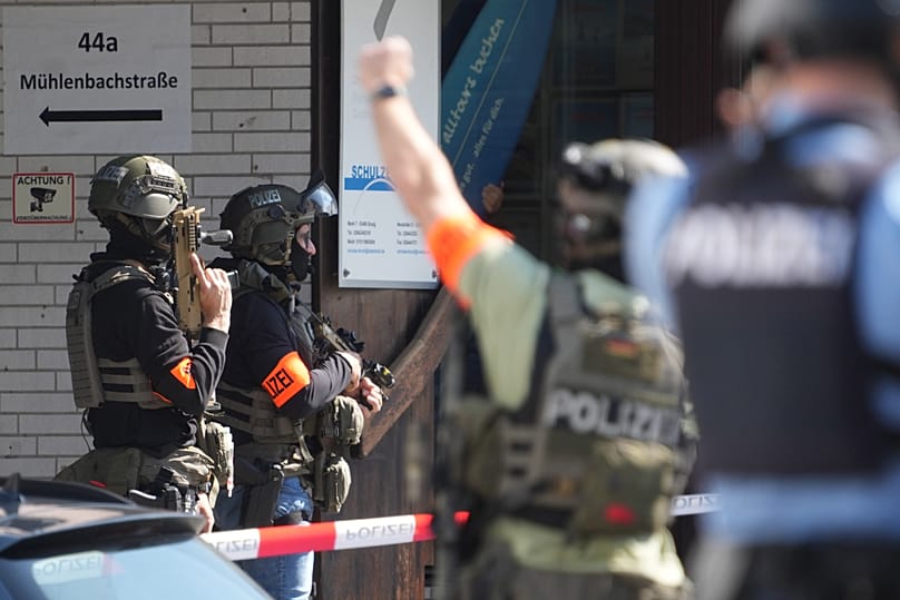Police officers at the scene of an incident where a hostage situation has occurred at a bank branch in Sinzig, 8 May, 2026