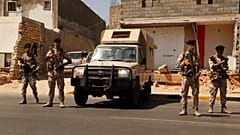 Libyan army forces and vehicles are deployed on a street in the capital Tripoli on Friday, 22 July 2022. (AP photo/Yousef Murad)