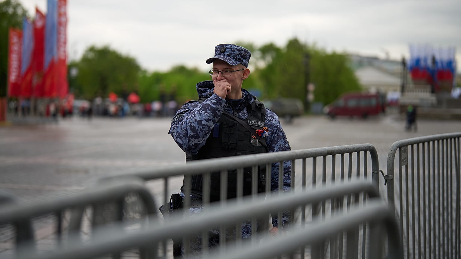 A Russian National Guard, known as a Rosguardia, stands at a police fence set up in Manezhnaya Square in Moscow, Russia, Friday, May 8, 2026,