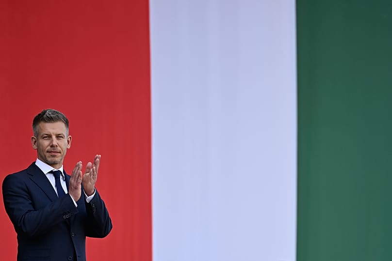 Hungarian Prime Minister Péter Magyar applauds in front of the Hungarian Parliament in Budapest, 9 May, 2026
