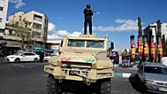 FILE: A member of police special forces stands guard on top their car at the Enqelab-e-Eslami, or Islamic Revolution, square in downtown Tehran, 30 March 2026